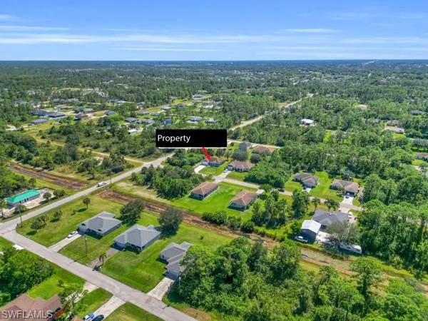 View of property location with nearby suburban area