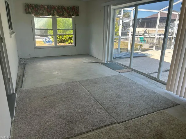 Laundry area with stacked washer / dryer