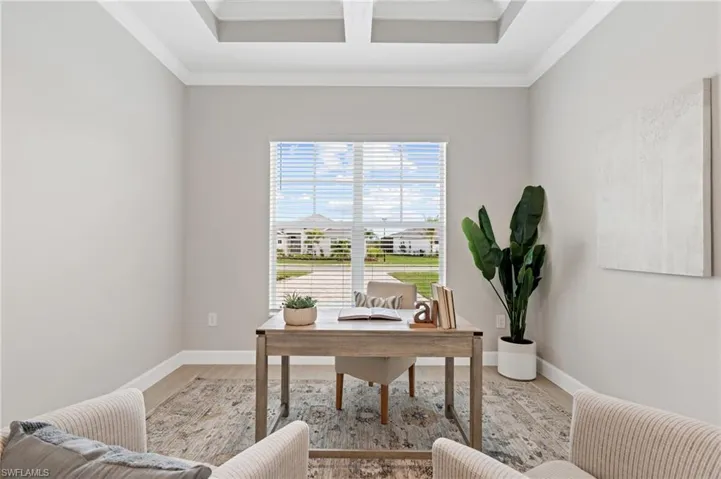 Office with crown molding and hardwood / wood-style floors