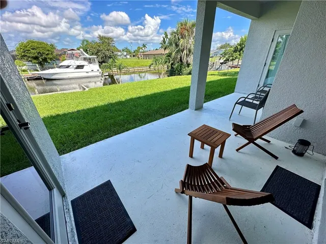 View of patio with a water view