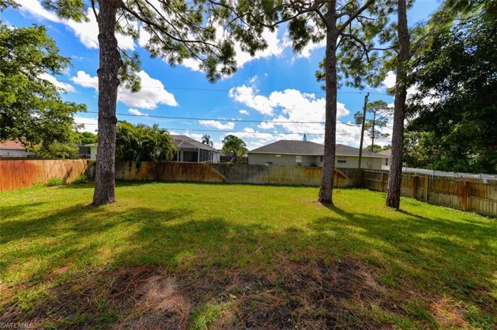 View of fenced backyard