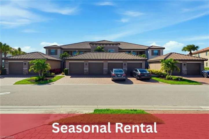 Multi-unit exterior featuring a tile roof, neutral stucco finish, paver driveways, and multiple attached garage bays