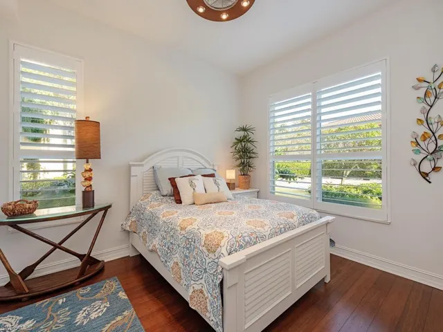 Bedroom featuring dark wood-type flooring