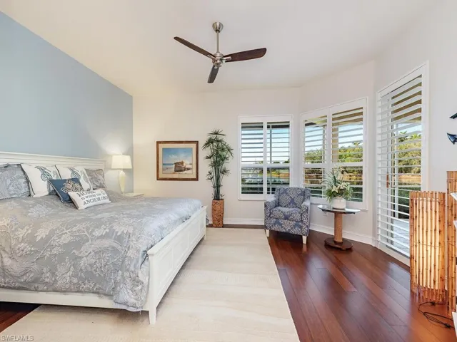 Bedroom with light wood-style floors and ceiling fan