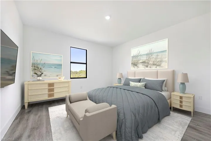 *Virtually Staged*Bedroom with wood finished floors and baseboards