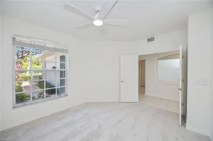 Den/3rd bedroom has double doors, new carpet and a new fan