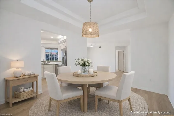AI Renovated/Virtually Staged. Dining Room with tray ceiling and pre-wired for a light fixture of your choice.