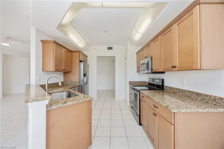 Kitchen with updated cabinetry and stainless steel appliances