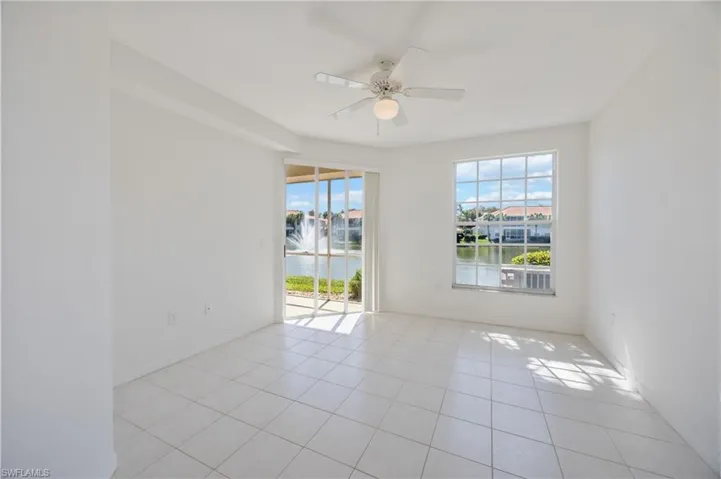 Primary bedroom with sliding door access to the lanai