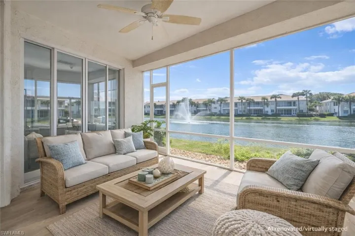AI Renovated/Virtually Staged.  Screened in lanai with Southern lake and fountain views