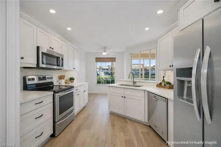 AI Renovated/Virtually Staged. Kitchen with updated cabinetry and stainless steel appliances