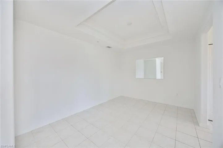 Dining Room with tray ceiling and pre-wired for a light fixture of your choice.