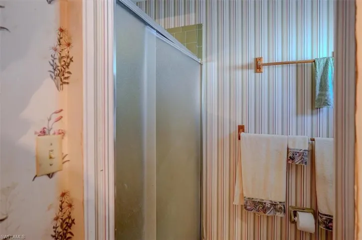 Bathroom with a shower with shower door