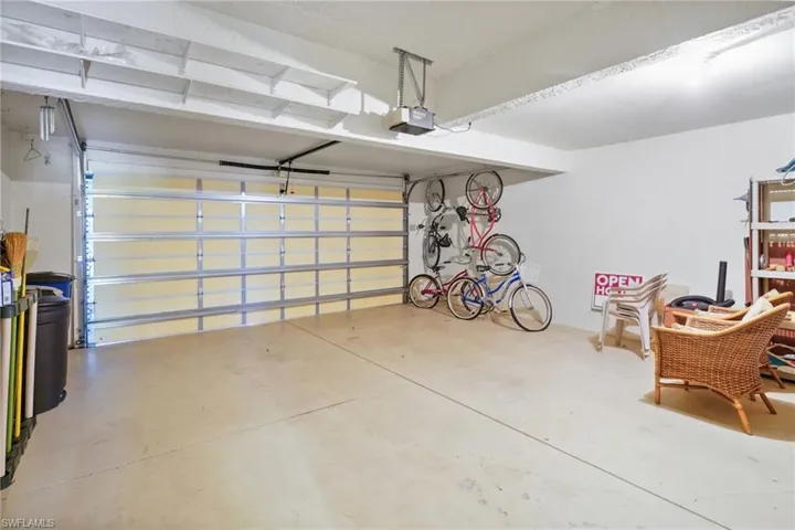 Garage featuring a garage door opener