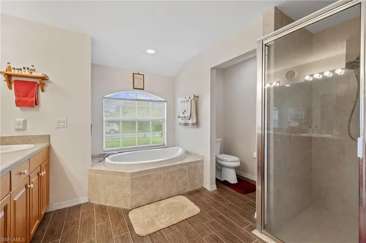 Primary Bathroom with soaking tub and separate tile shower