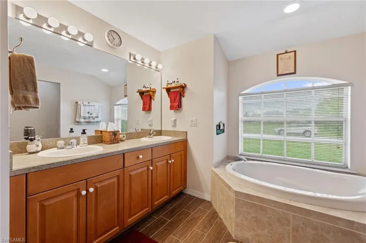 Primary Bathroom with dual sinks and soaking tub