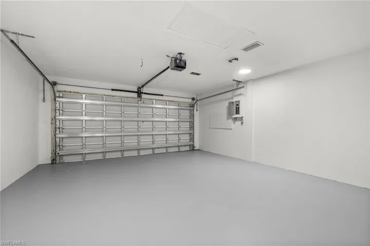 Garage featuring a garage door opener