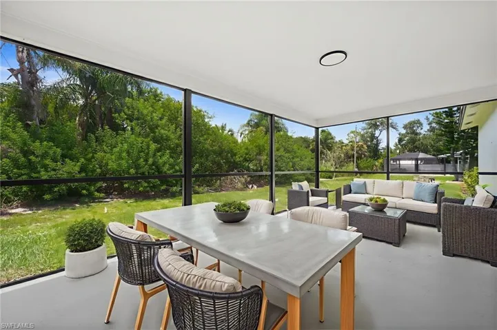 Sunroom / solarium featuring an outdoor hangout area and outdoor dining area