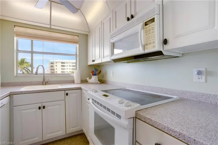 White cabinetry and Corian counters!