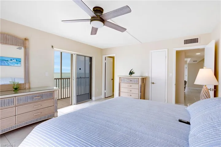 Newer furniture, fan, and walk in closet.