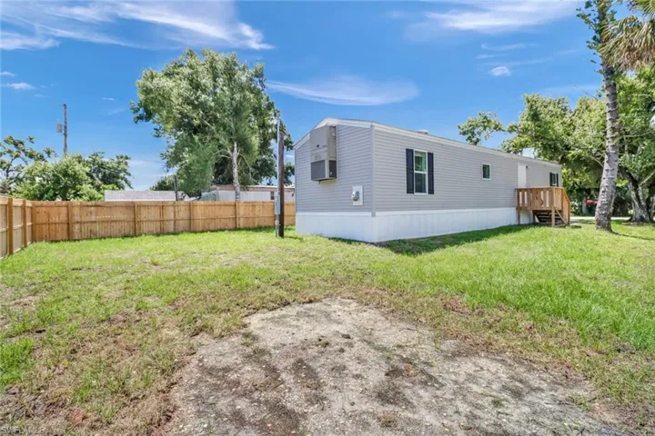 View of yard with a wooden deck