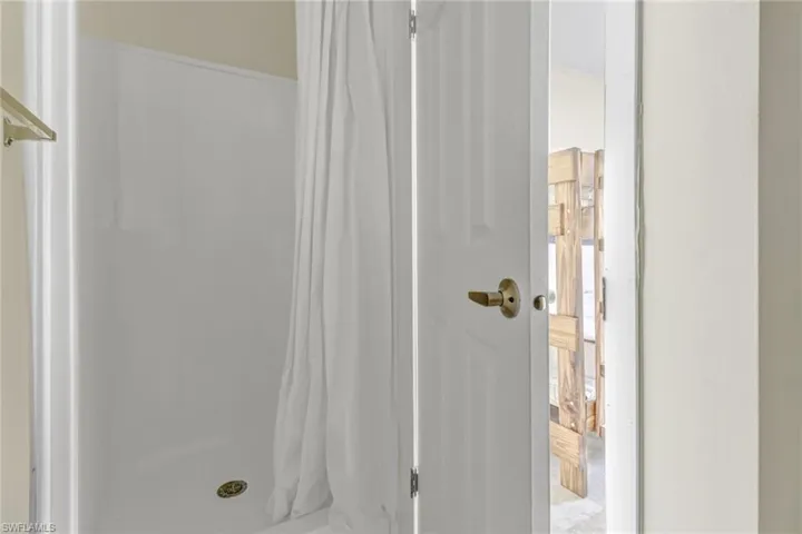 Bathroom with curtained shower