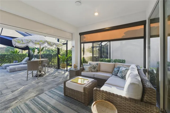 Sunroom featuring an outdoor hangout area, a patio, and recessed lighting