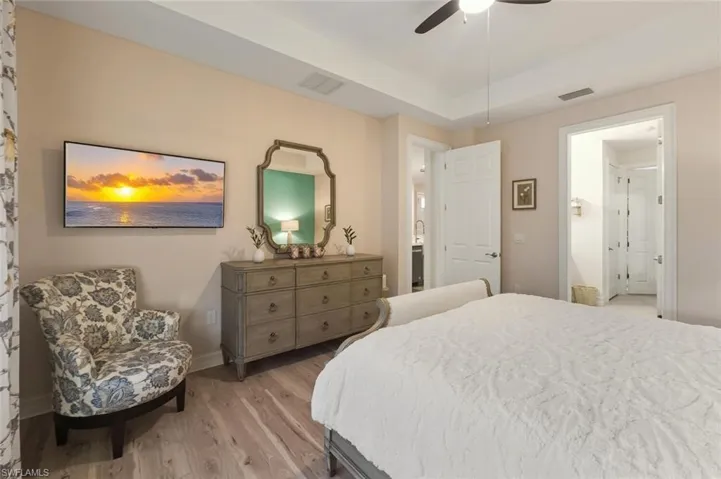 Bedroom featuring light wood-type flooring and ceiling fan
