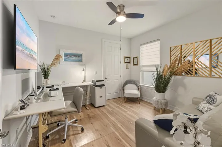 Office featuring light wood-style floors and a ceiling fan