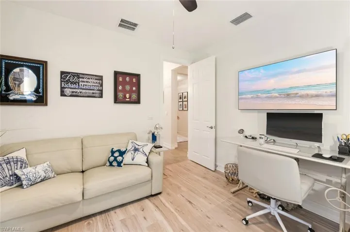 Office area featuring wood finished floors and ceiling fan