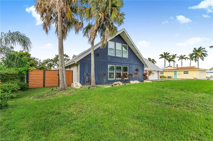 Back of house with a garage