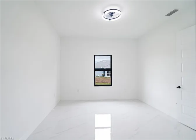 Empty room with light marble finish flooring