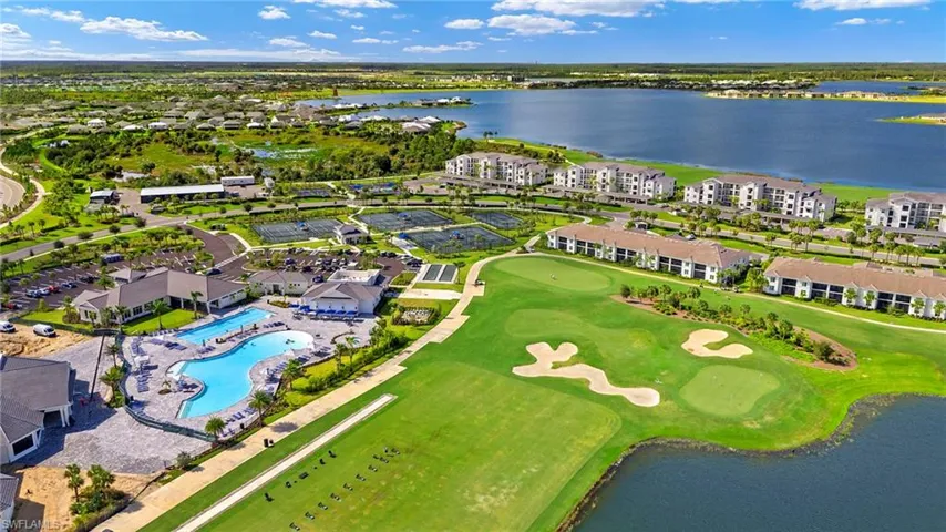 View of property location featuring a nearby body of water and a golf course