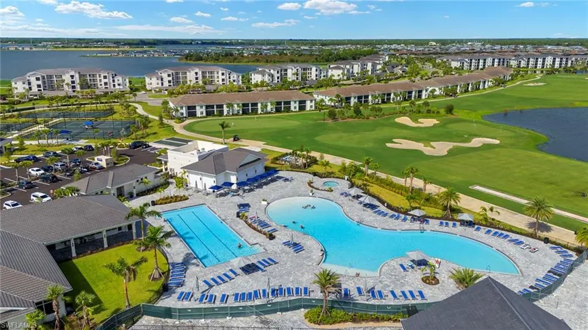 Drone / aerial view of a golf club and a large body of water