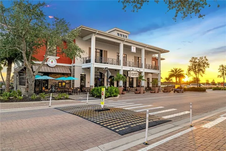 View of property at dusk