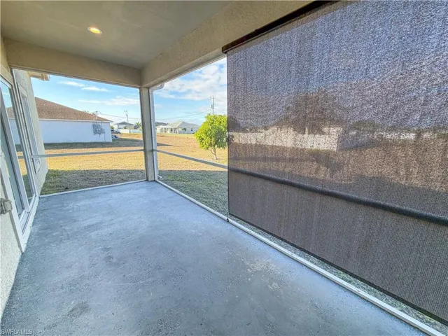 Unfurnished sunroom featuring a residential view