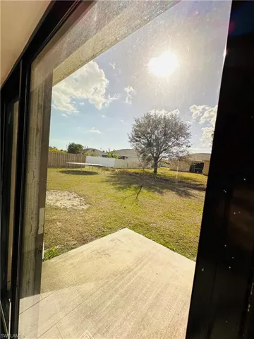 Fenced yard with a patio