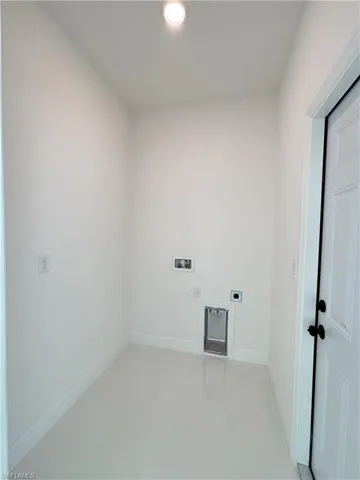 Laundry area featuring hookup for an electric dryer, washer hookup, and recessed lighting
