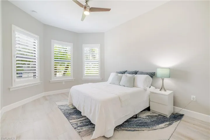 Bedroom with light wood-style flooring and ceiling fan