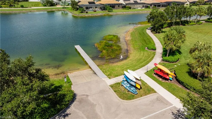 Aerial view of residential area featuring a large body of water