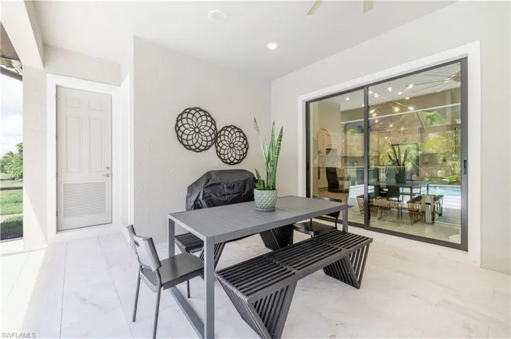 Dining room featuring a sunroom, plenty of natural light, recessed lighting, and ceiling fan