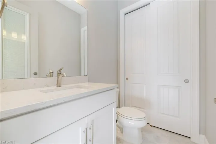 Bathroom featuring vanity and light tile patterned floors