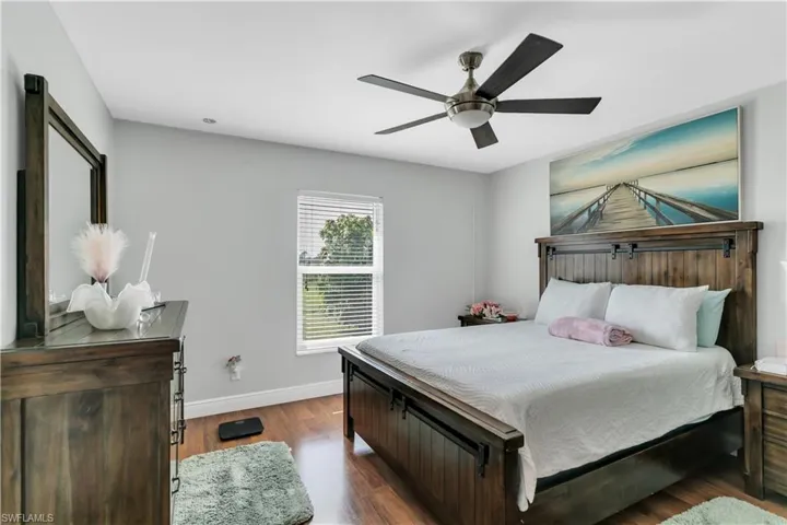 Master Bedroom featuring ceiling fan and dark wood-type flooring