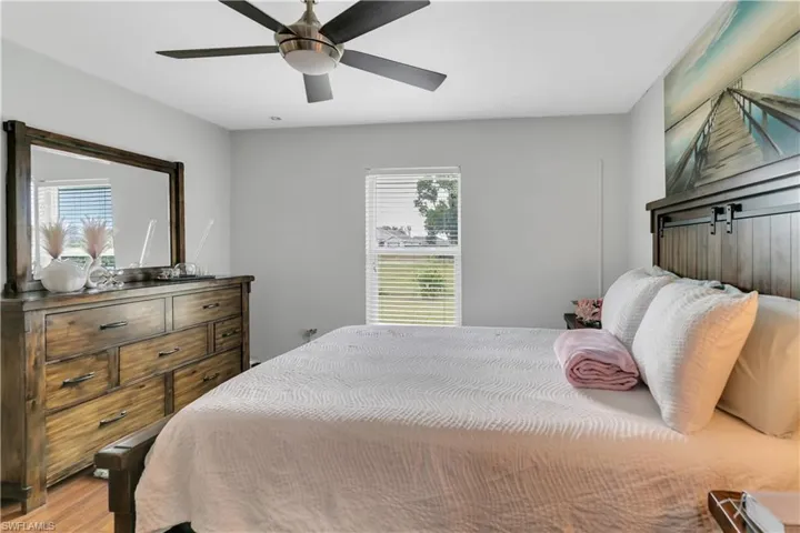 Master Bedroom with ceiling fan and light wood-type flooring