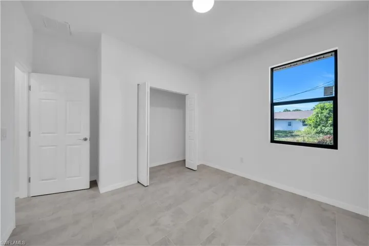 Unfurnished bedroom featuring baseboards