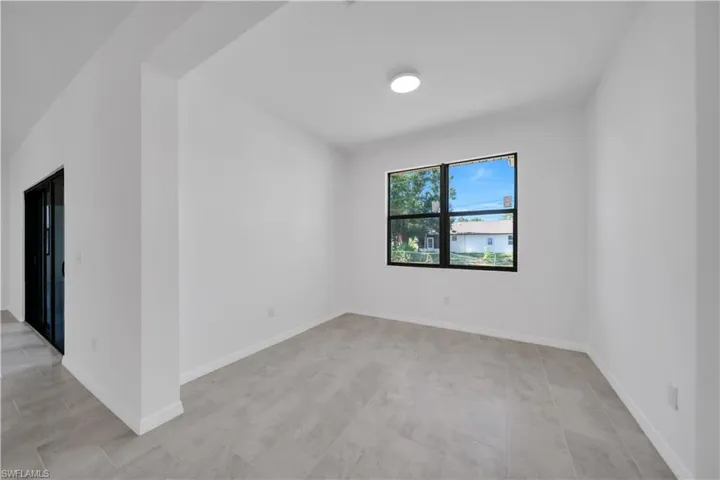 Unfurnished room featuring baseboards