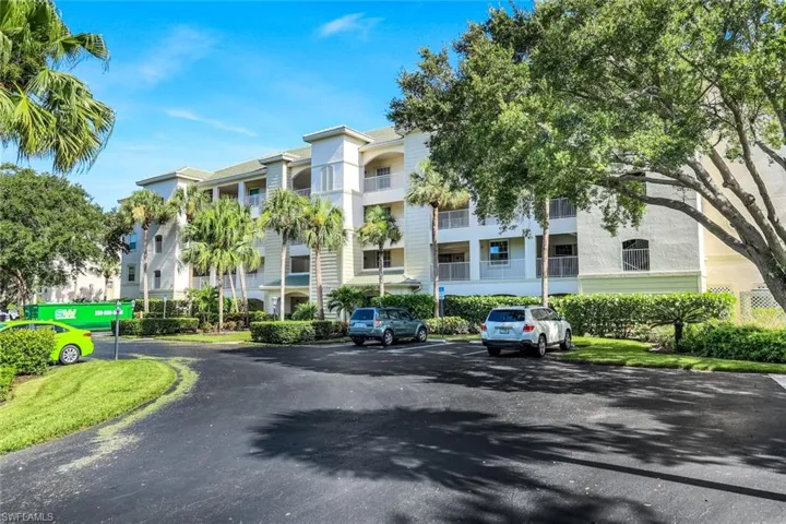 View of property with uncovered parking in Addition to your Private Garage under the Building