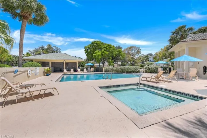 Community pool with a patio area & Hot Tub....