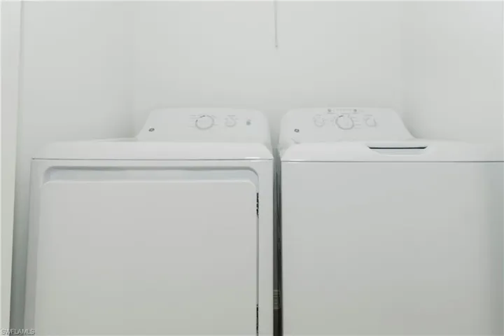 Laundry area featuring independent washer and dryer