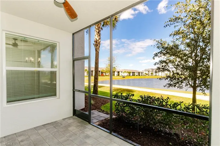 Unfurnished sunroom with a water view